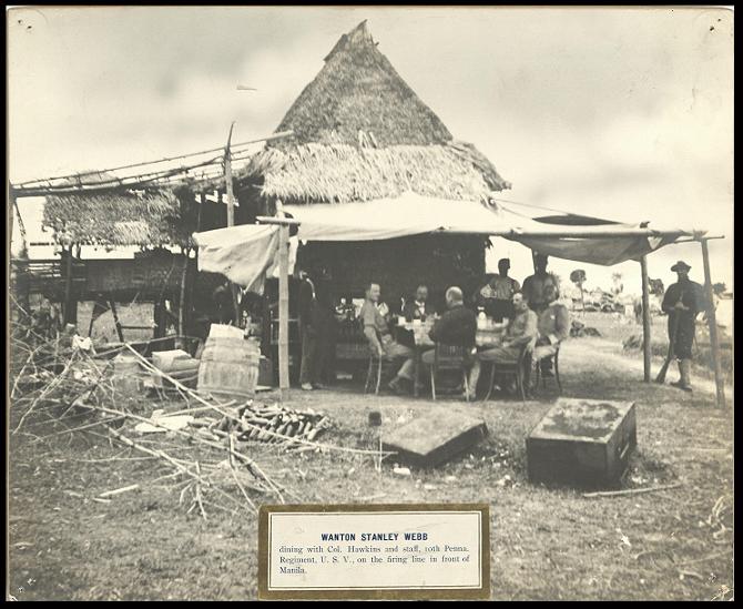 Wanton Stanley Webb dining with Col. Hawkins and staff, 10th Penna. [Pennsylvania] Regiment, U.S.V., on the firing line in front of Manila.
