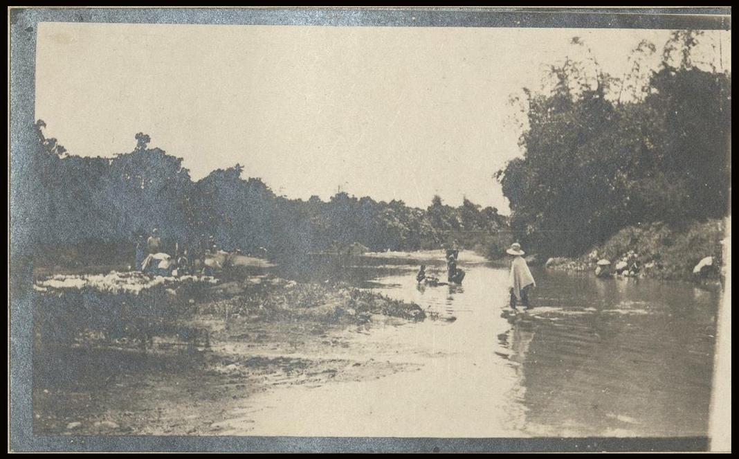 [Untitled – Washing laundry in a river, Philippines].