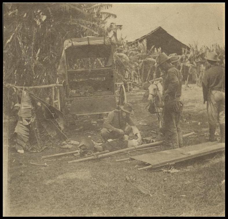 Ambulance & wounded man at Calumpil [Calumpit].