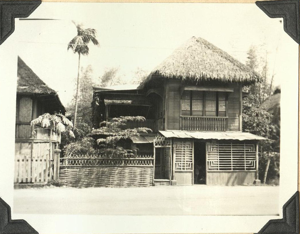 [Untitled – Tidy thatched-roof homes – Pampanga?].