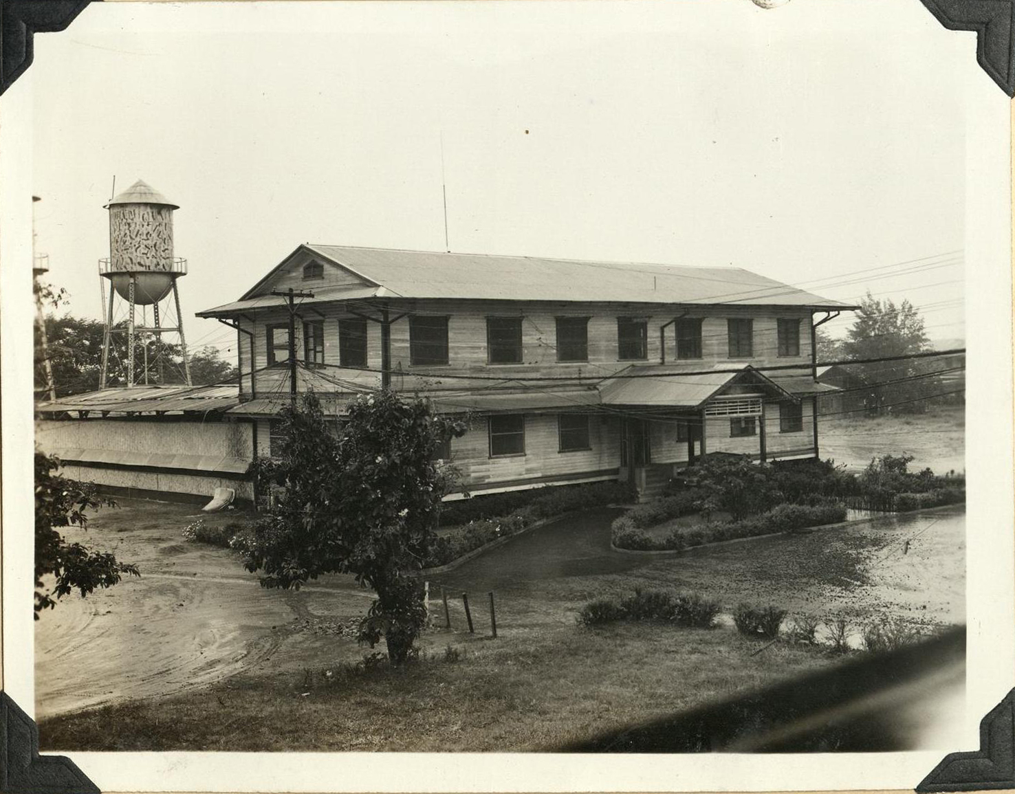 [Untitled – Building and water tower, Clark Air Base].