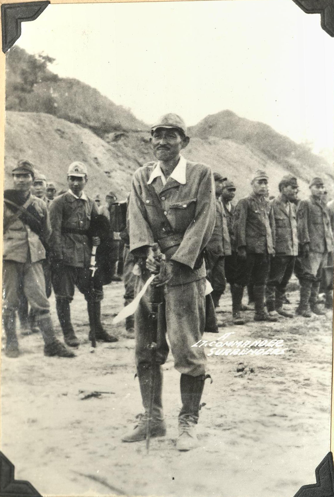 A Lt. Commander surrenders.