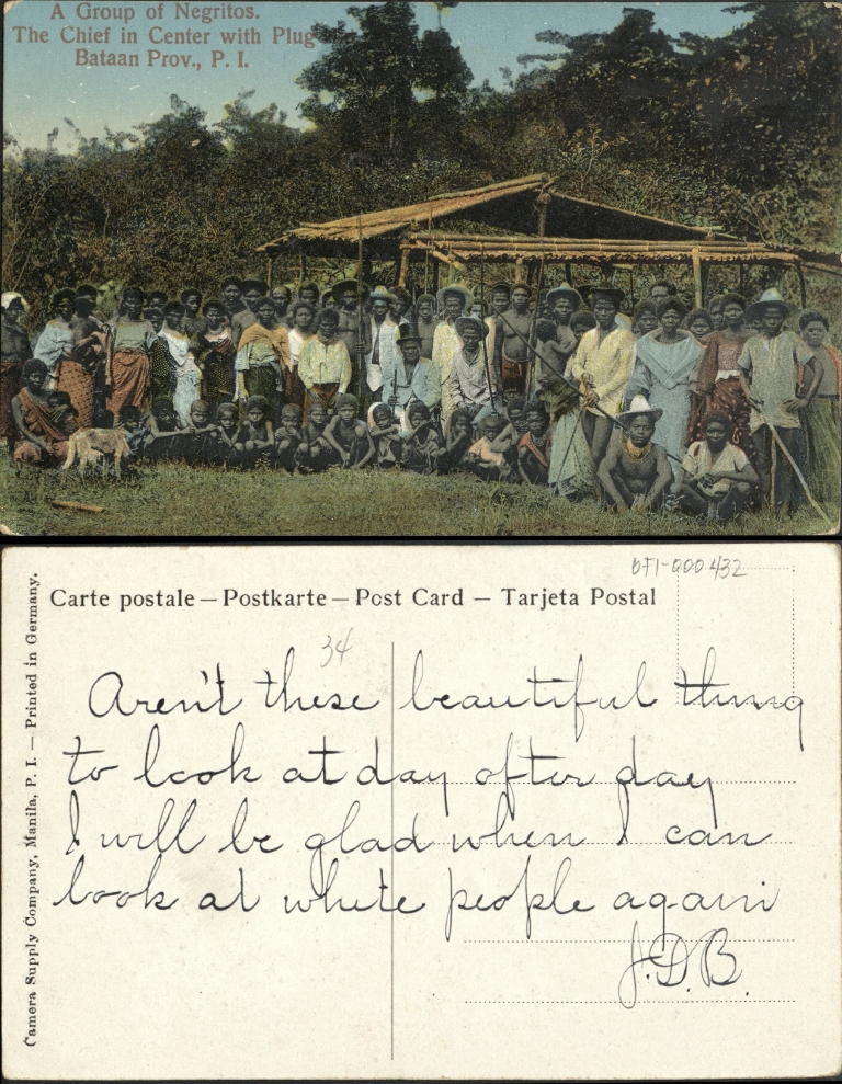 A group of Negritos [Aeta]. The chief in center with plug hat. Bataan Prov. P. I.