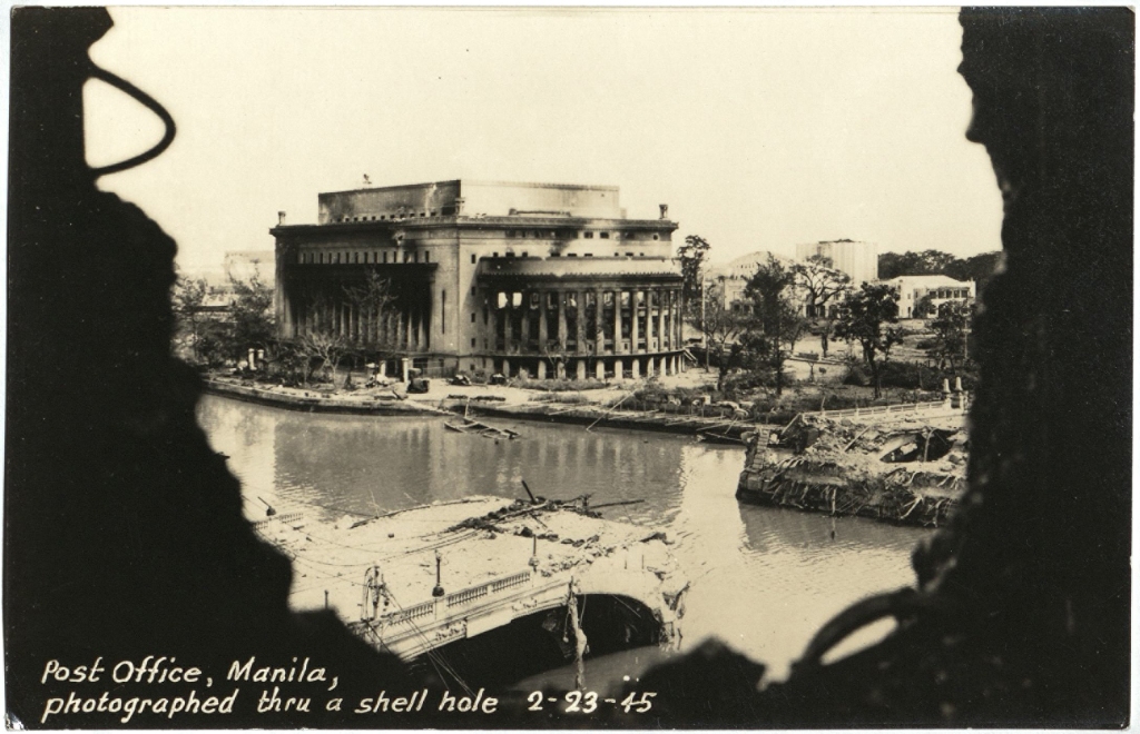Post Office, Manila, photographed thru a shell hole 2-23-45.