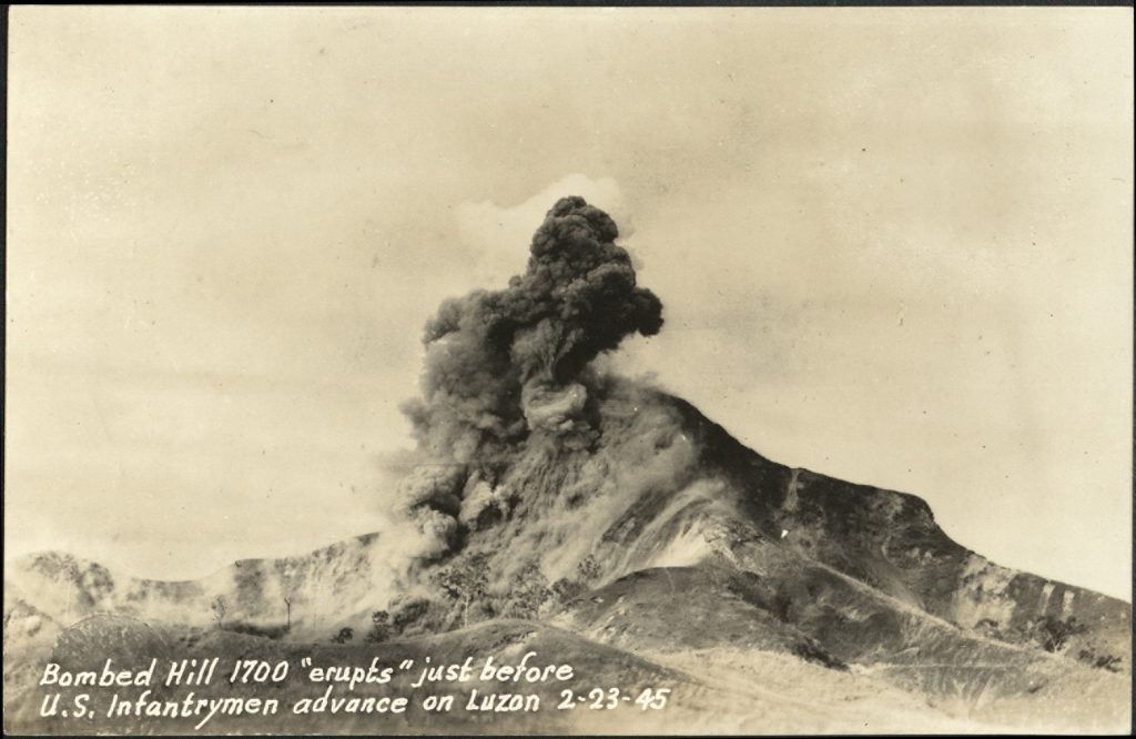 Bombed Hill 1700 “erupts” just before U.S. infantrymen advance on Luzon, 2-23-45.
