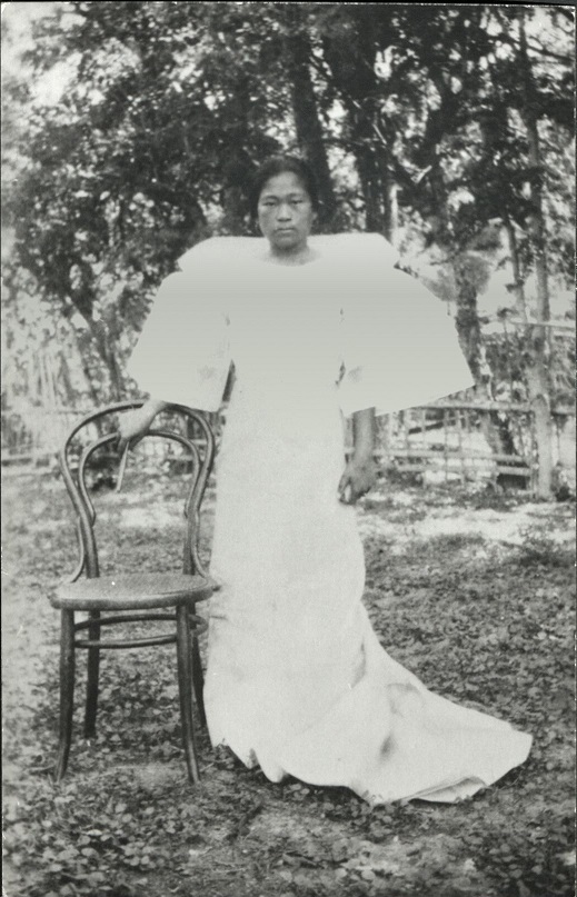 [Untitled – Woman outdoors in formal dress]