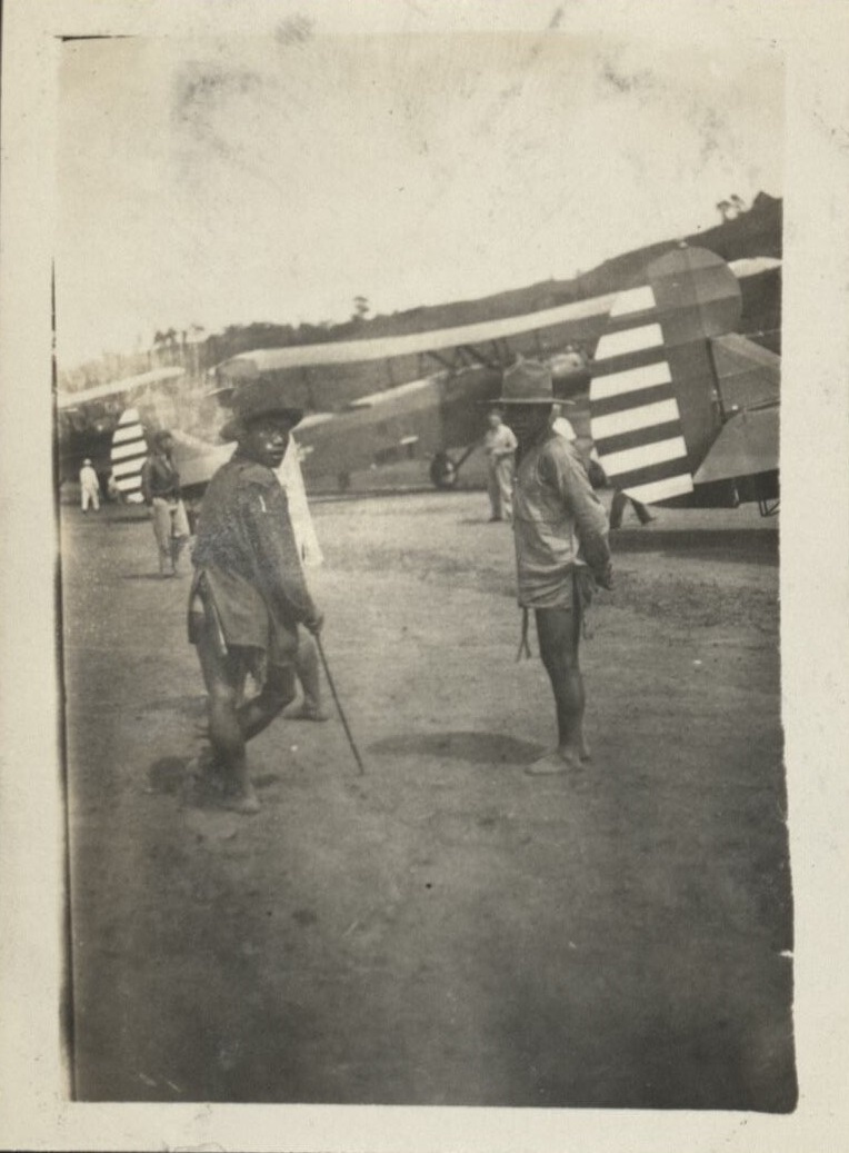 Igorots looking at Army bombing planes at Baguio Airport.