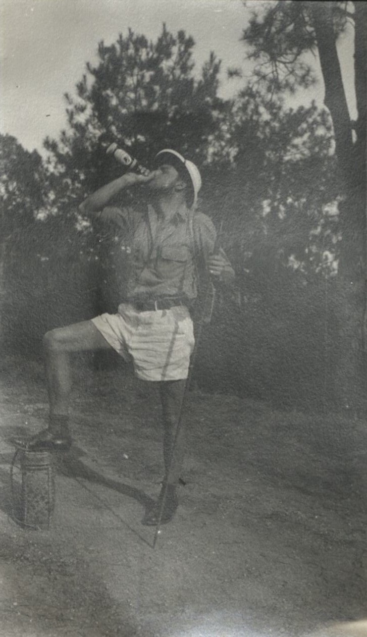 In the Philippine jungles, with Rev. A. L. Griffiths and Mr. F. G. Bull. Just a little swig.