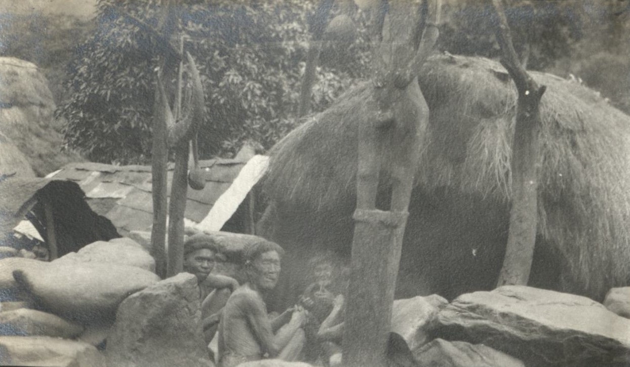 Igorot men gathered together at the ulug.