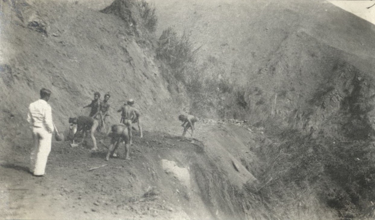 Clearing away a landslide on the Bontoc Road.