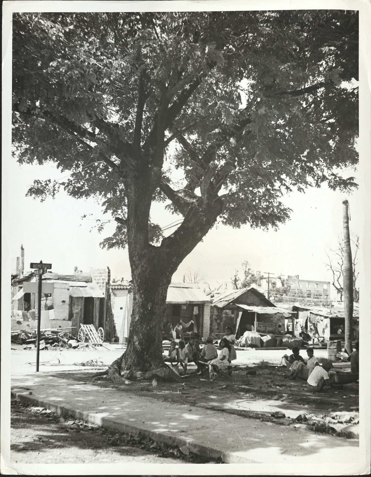 13. PHILIPPINES – Manila. Temporary housing quarters for Manila natives are built of salvaged materials taken from the rubble heaps of the wrecked city.  J-1441.