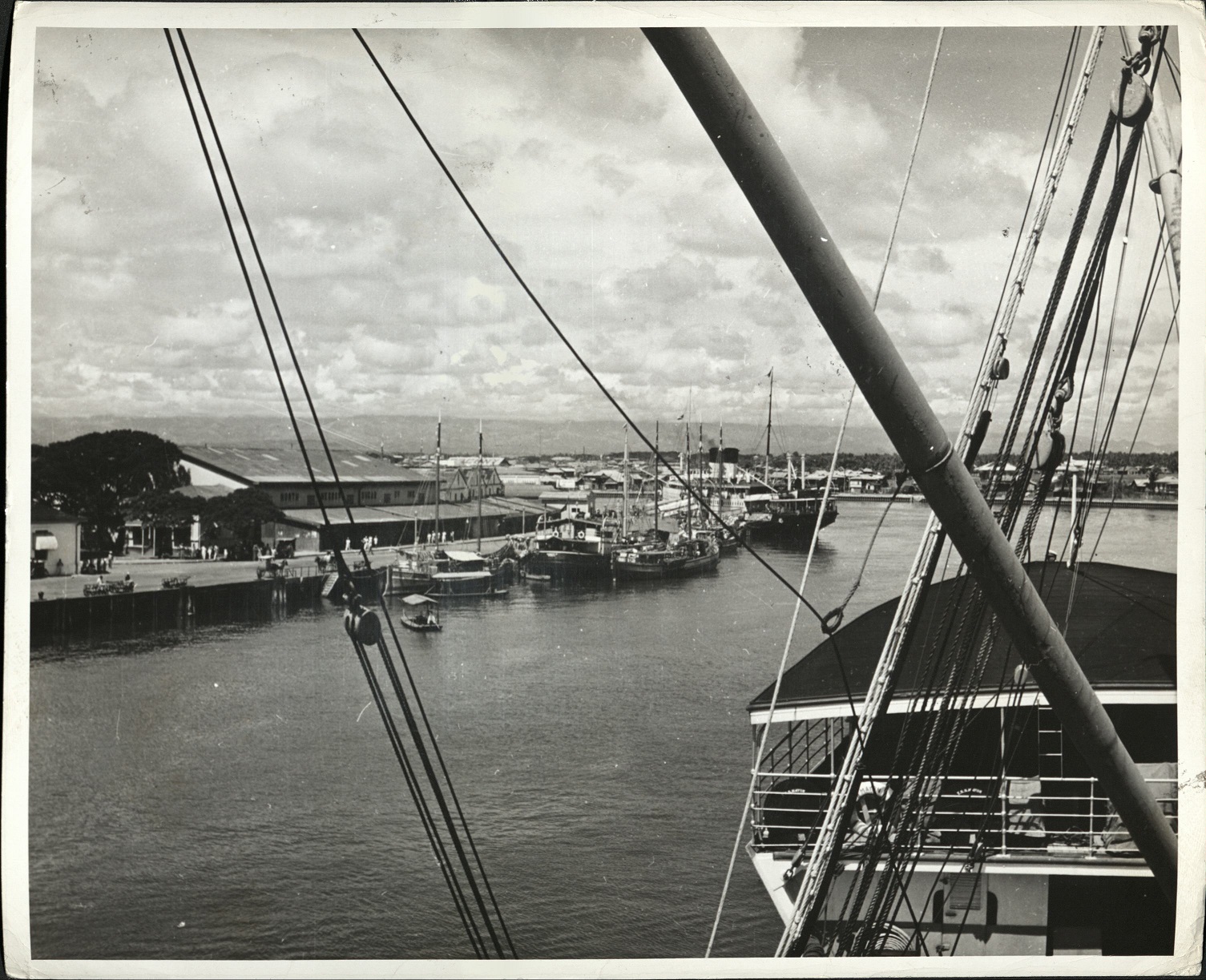 105. PHILIPPINES: Harbor of Iloilo, across from Cebu. Motor launches, river boats, and various types of watercraft can be seen.