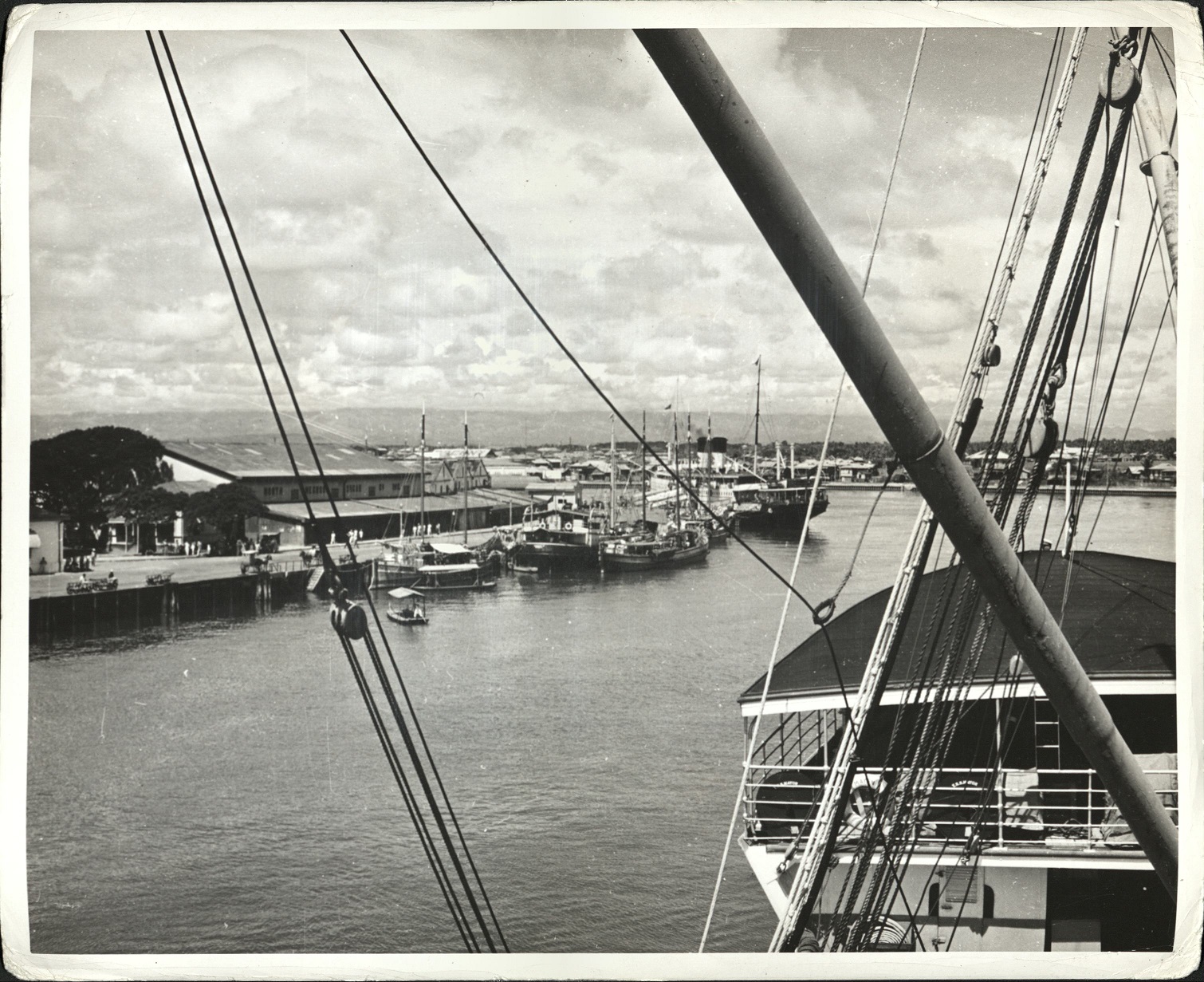 92. PHILIPPINES: Harbor of Iloilo, across from Cebu. Motor launches, river boats, and various types of watercraft can be seen. Jacobs – 1214.