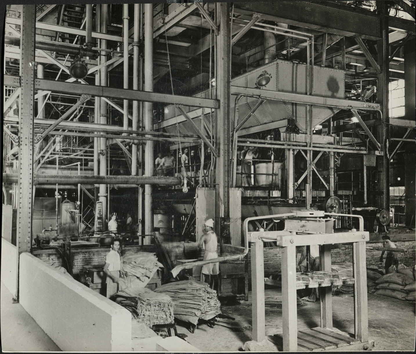 19. PHILIPPINES: Interior of a sugar refinery showing the most modern type of factory installation. (…)