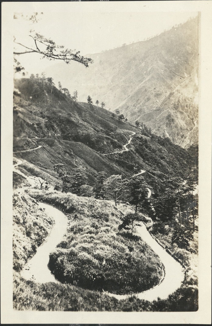 Benguet Road – “Zig Zag Trail.” Note tropical trees and pine trees as well. A beautiful mountain torrent courses down to the sea. …