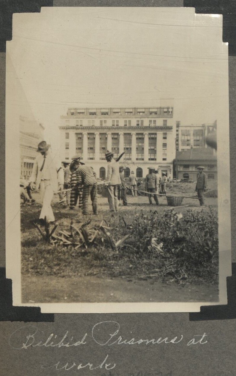 Bilibid prisoners at work [First National City Bank building, Binondo].