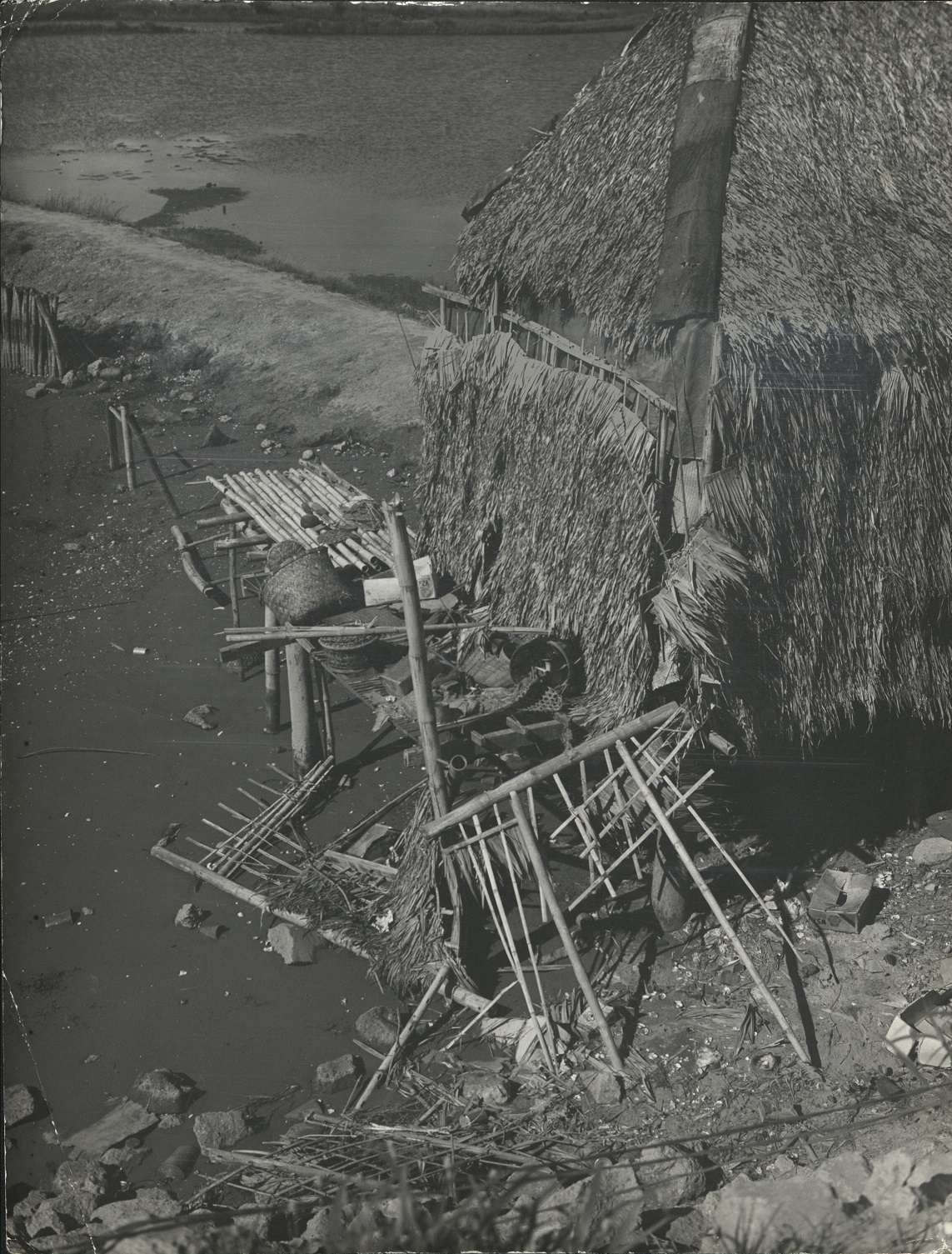 P 54. A fisherman’s hut built in Manila Harbor. Everything in this picture is made by hand.