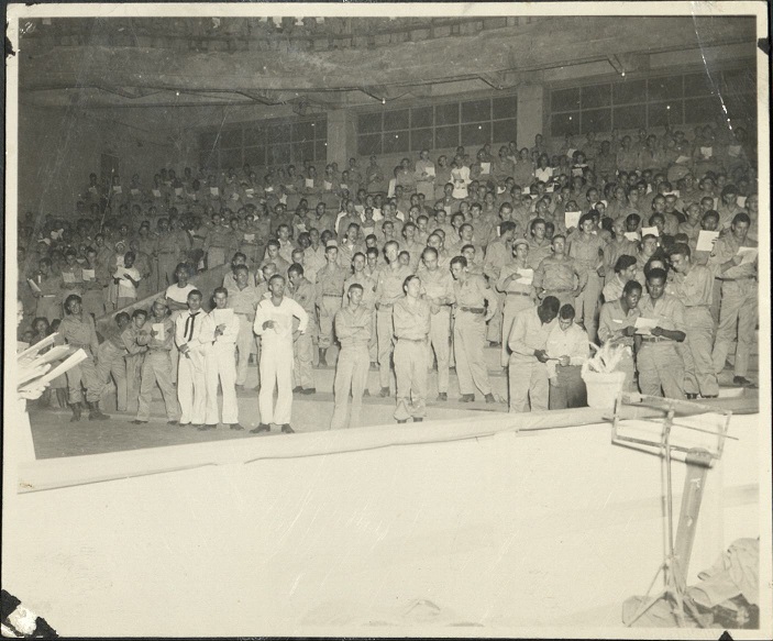International [Male] Chorus, rehearsing “The Messiah.” Manila, P. I., Dec. 1945.