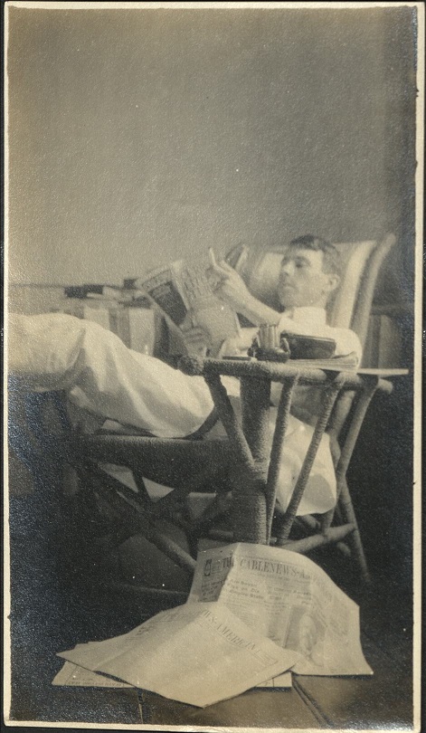 [Unititled – American man reading newspapers].
