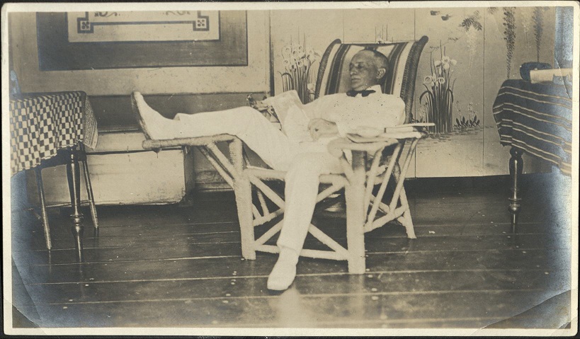 [Untitled – Man relaxing in lounge chair].
