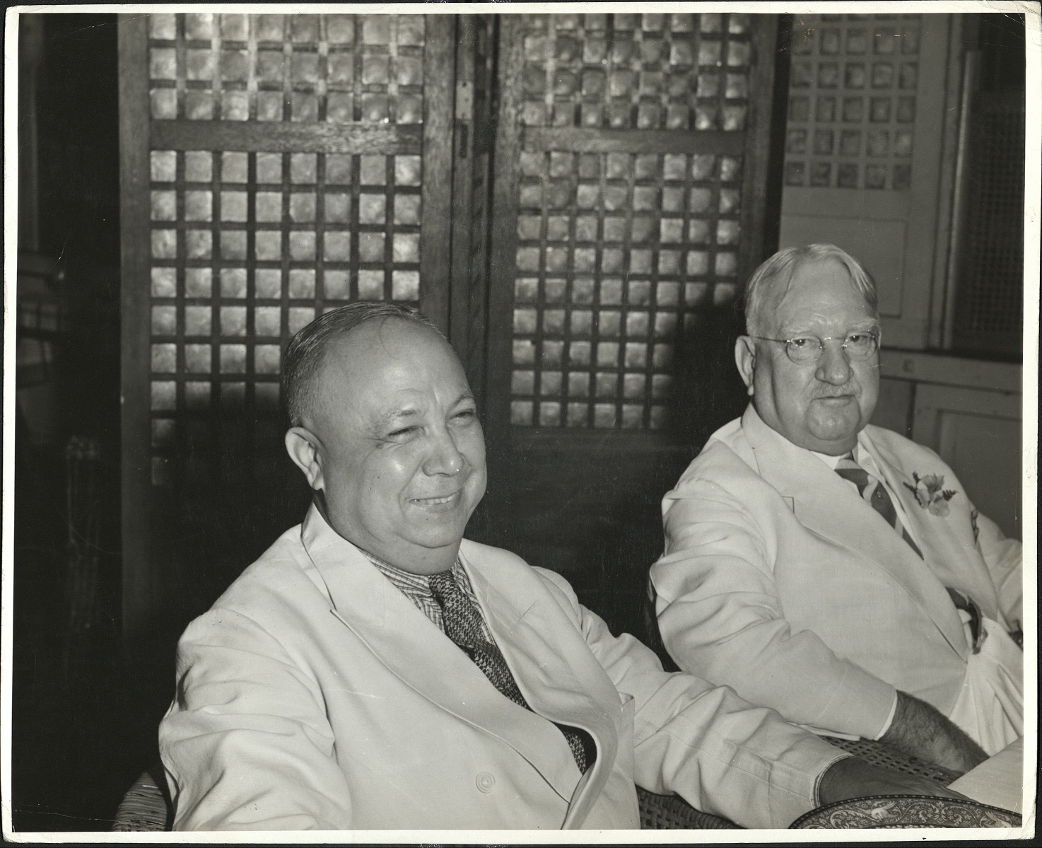 Mr. V. [Vicente] Madrigal, principal Filipino businessman, on the left, and Judge [John W.] Hauserman [Hausermann] on the right.