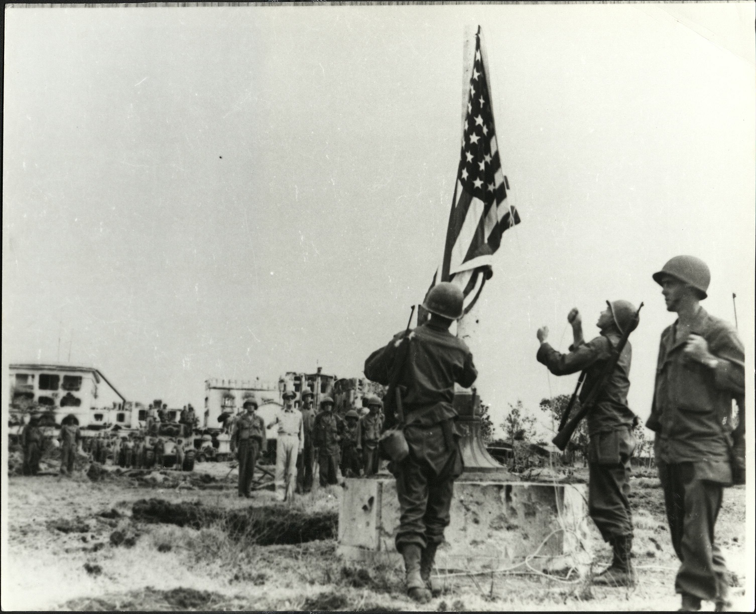 Raising the flag in front of the U.S. High Commission to the Philippines as Gen. Douglas MacAthur observes.