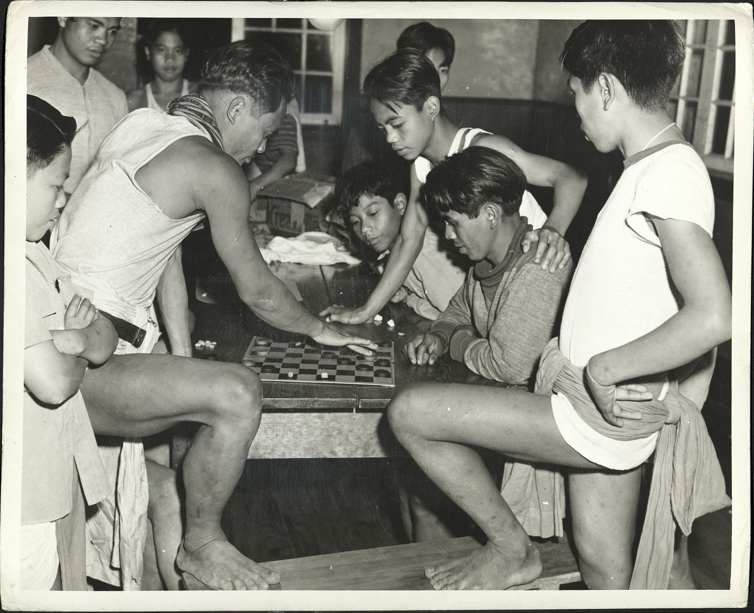 136. PHILIPPINES: Igorot boys playing checkers in an Episcopalian mission.