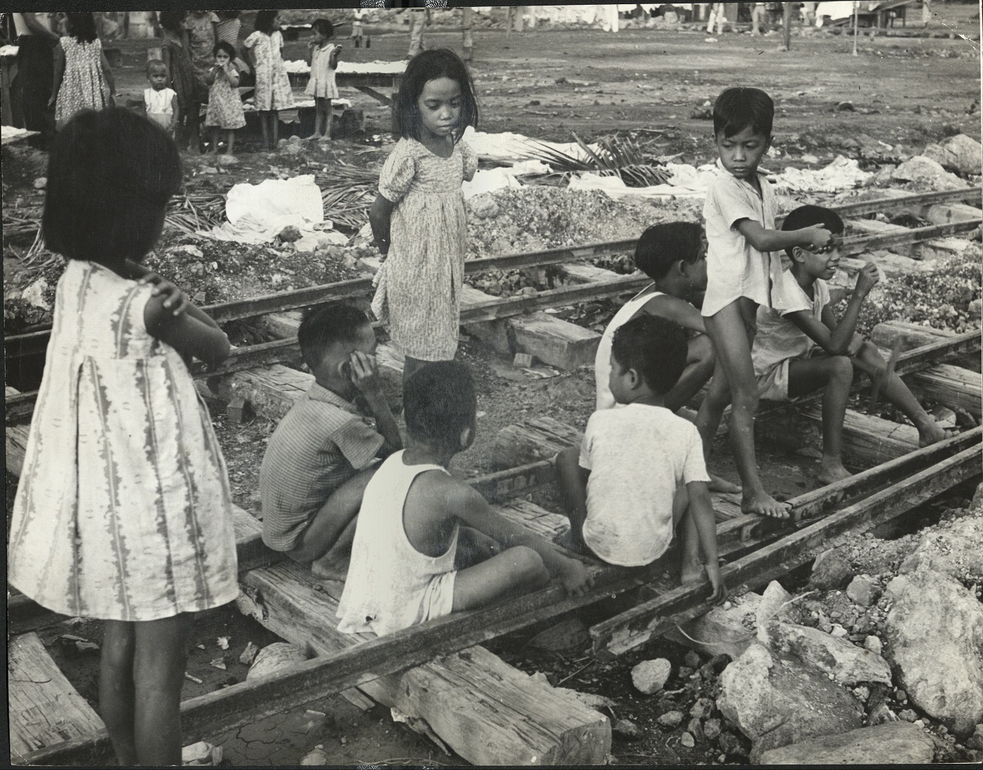331. PHILIPPINES: These children seem to prefer the railroad tracks as a playground, somewhere near [sic] Luzon.