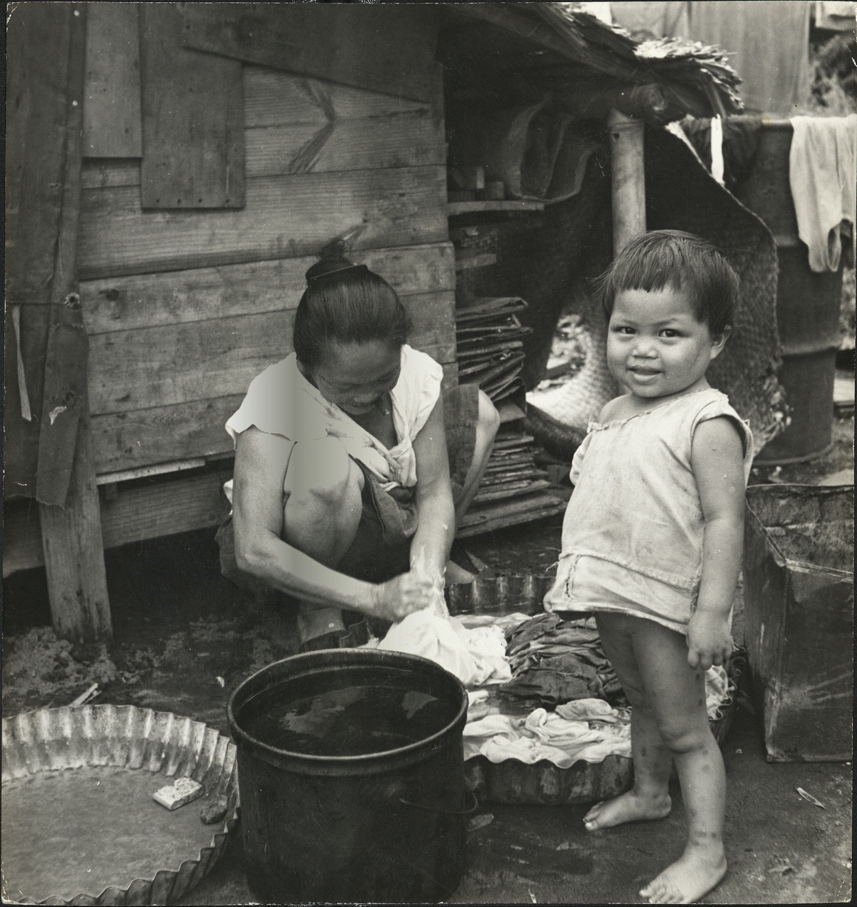 P 75a. Filipino women still smoke cheroots [cigars] in many of the islands. All water has to be carried from public wells. Leyte, P. I.