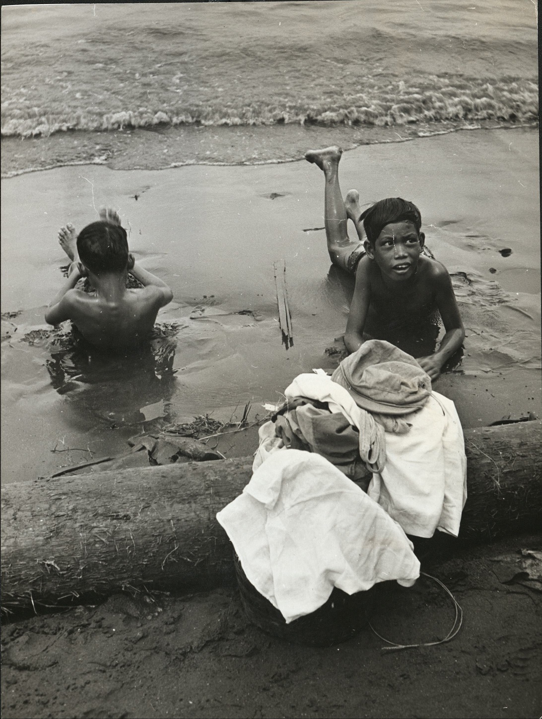 37. PHILIPPINES – Children. Manila youngsters see nothing wrong in surf bathing at Manila Bay.  J-1436.