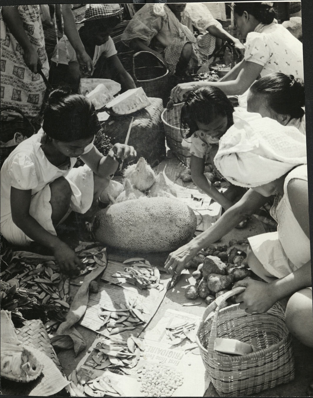 PHILIPPINES: Market place – buying and selling vegetables.