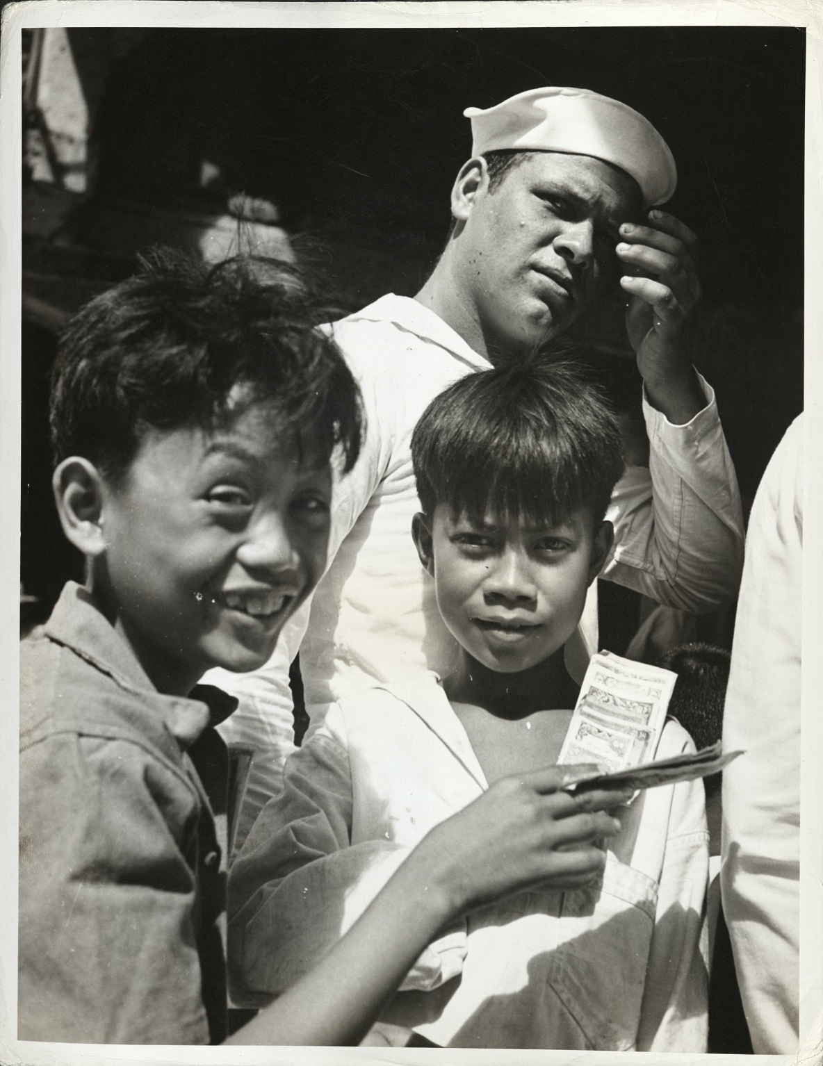 38. PHILIPPINES – Children. The glint in the eyes of these boys would indicate that they have been in mischief. J-1436.