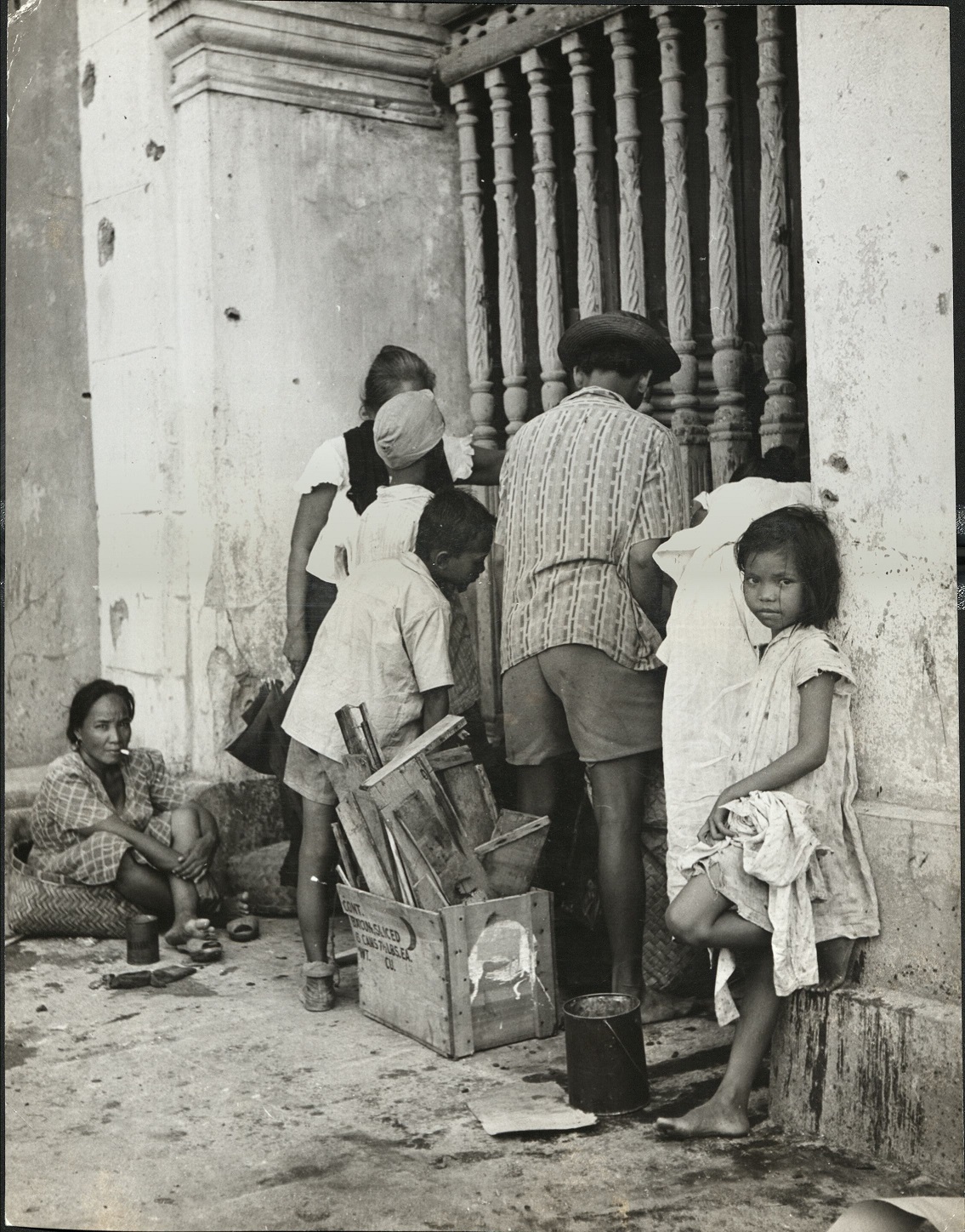 39. PHILIPPINES – Children. Undernourished Manila children on the street near their home.  J-1436.