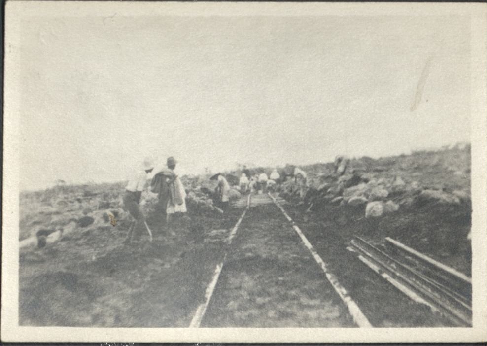 [Untitled – Digging out and repairing railroad tracks after a flood or landslide].