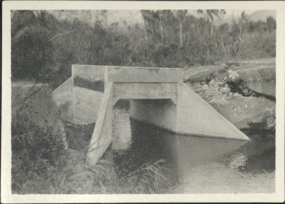 [Untitled – Washed-out railroad bridge and tracks after a flood or landslide].