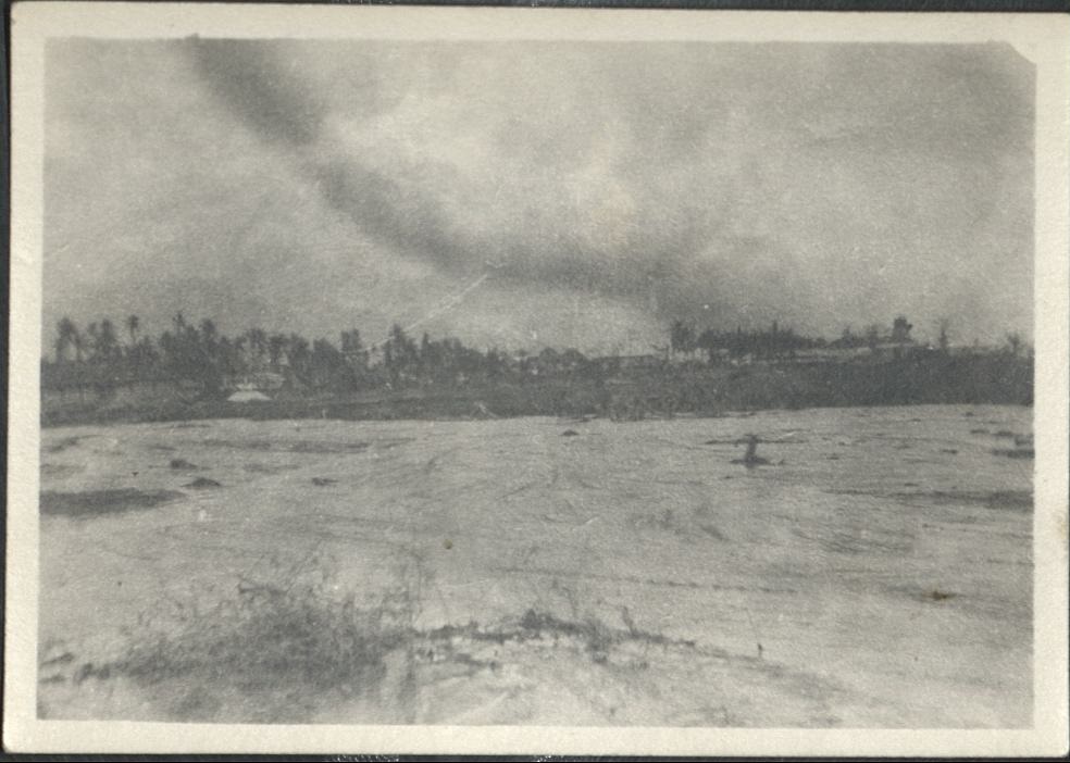 [Untitled – Debris in flooded river, likely the typhoon that wrecked the railroad tracks].