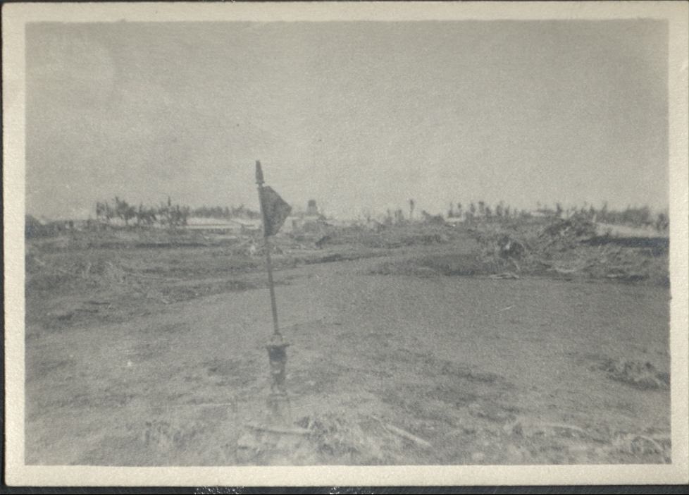 [Untitled – Flood damage – mud, vegetation, and washed-out roads after a typhoon].
