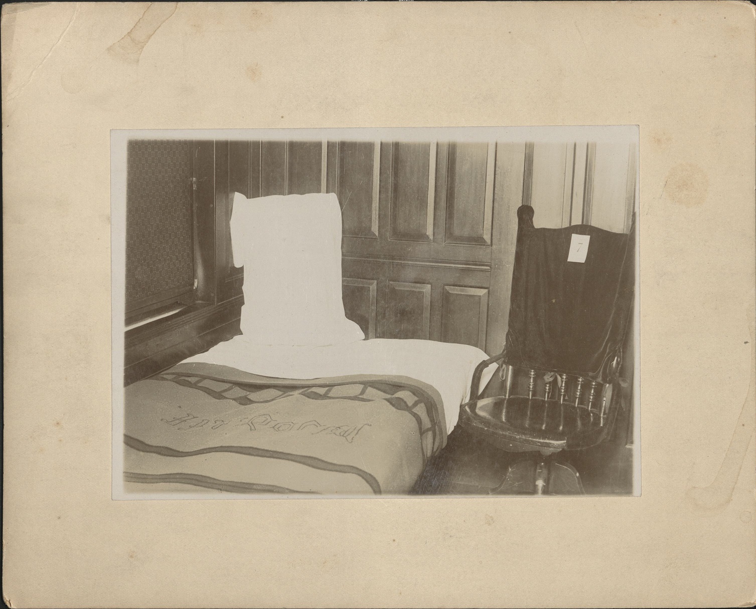 [Untitled ï¿½ Bed, pillow, and chair. Hotel room?].