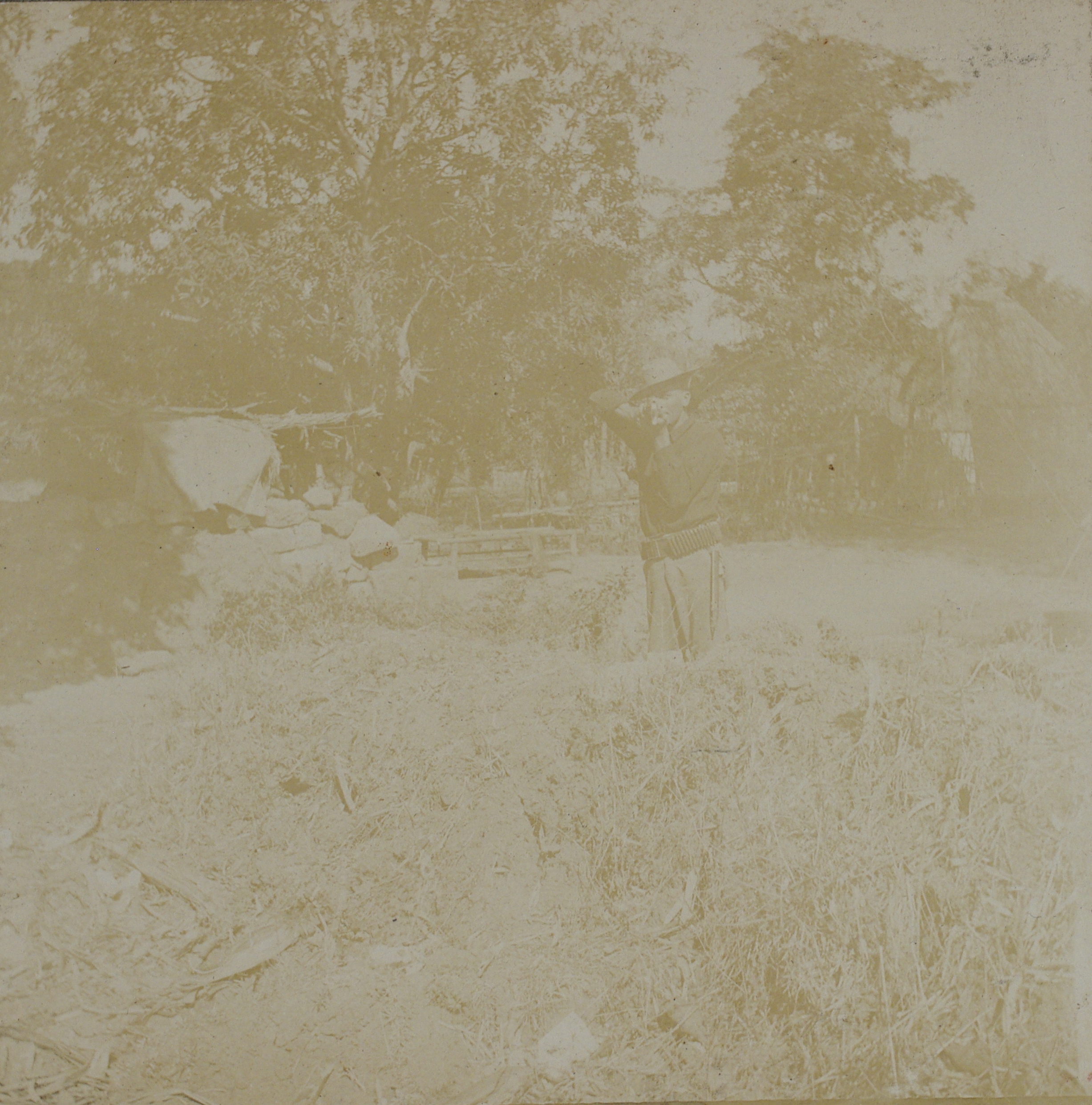 [Untitled – U.S. soldier in trench aiming rifle at viewer].