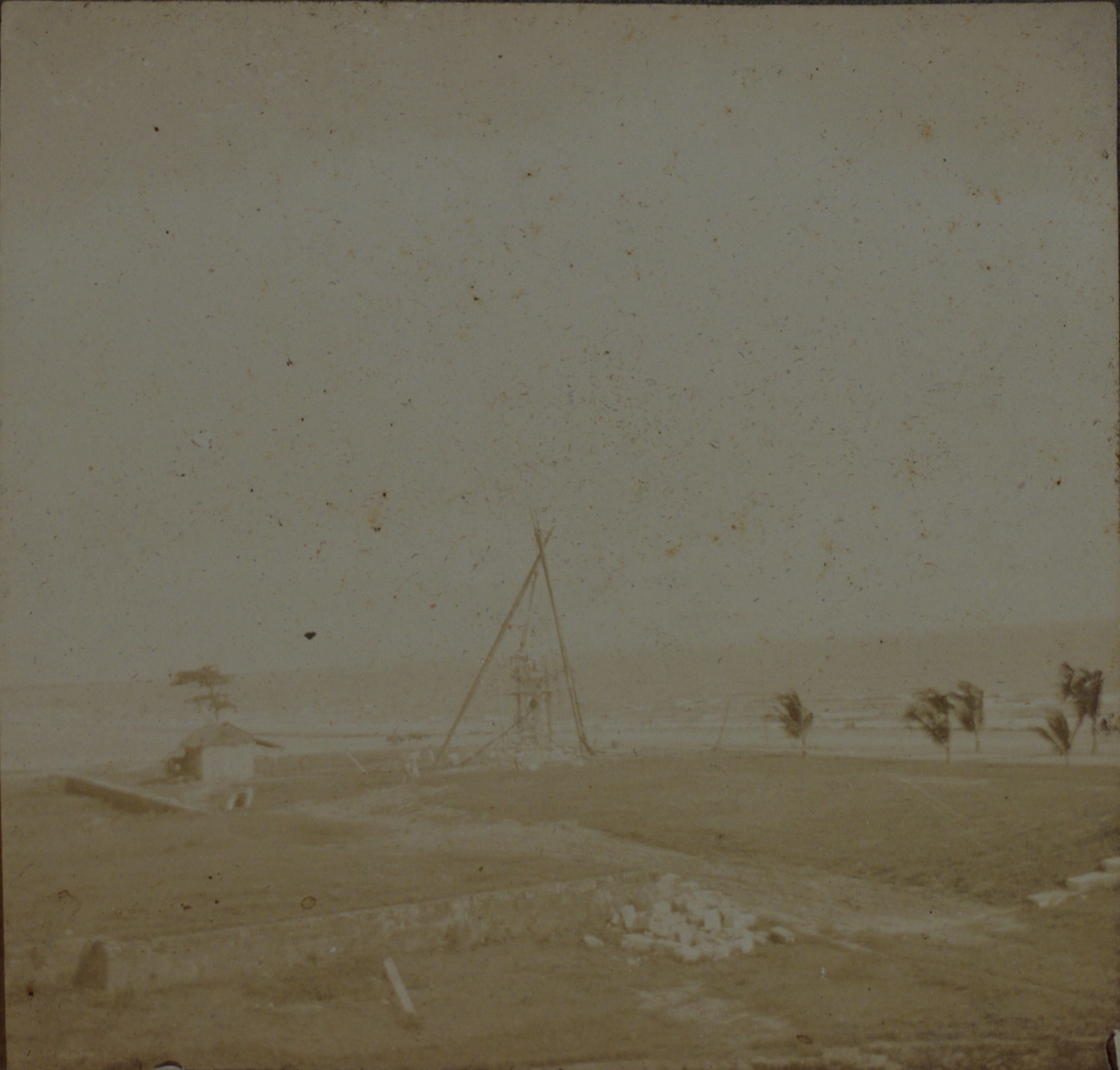 [Untitled – Large tripod structure (scaffolding?) on Philippine shoreline].