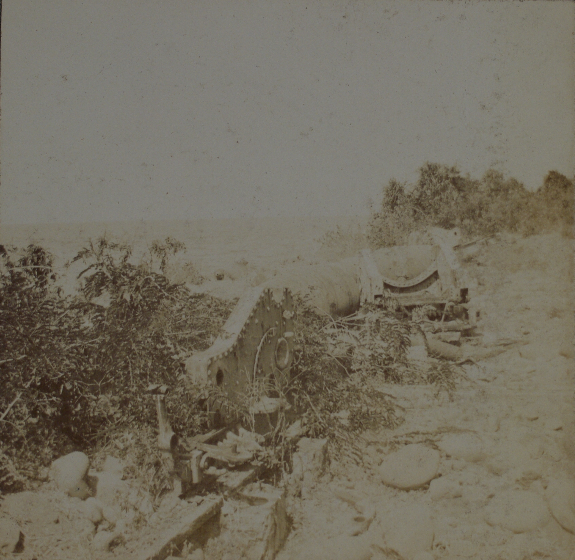 [Untitled – Pediment of building facade and a gun carriage?].