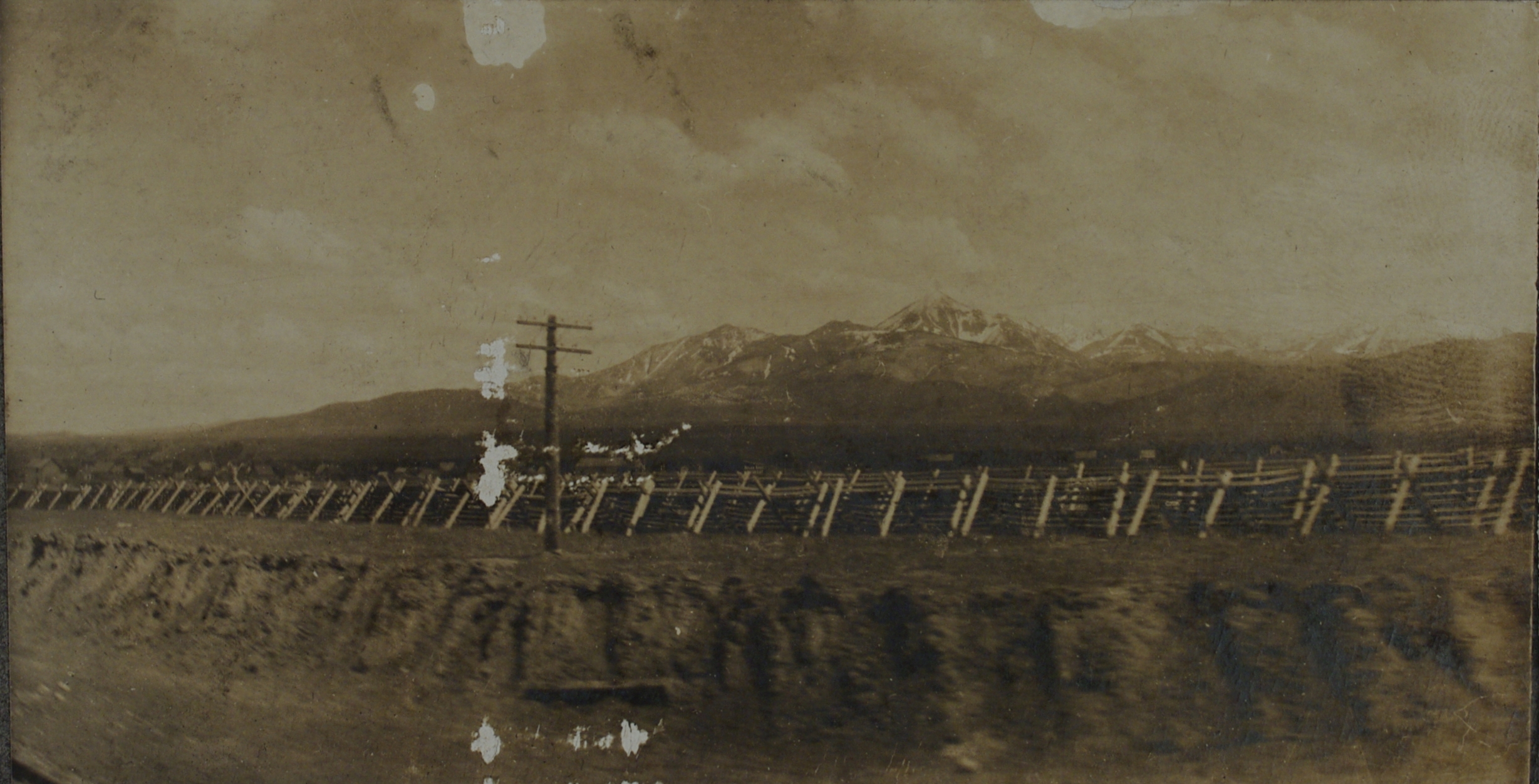[Untitled – View from railroad train at tall mountains].
