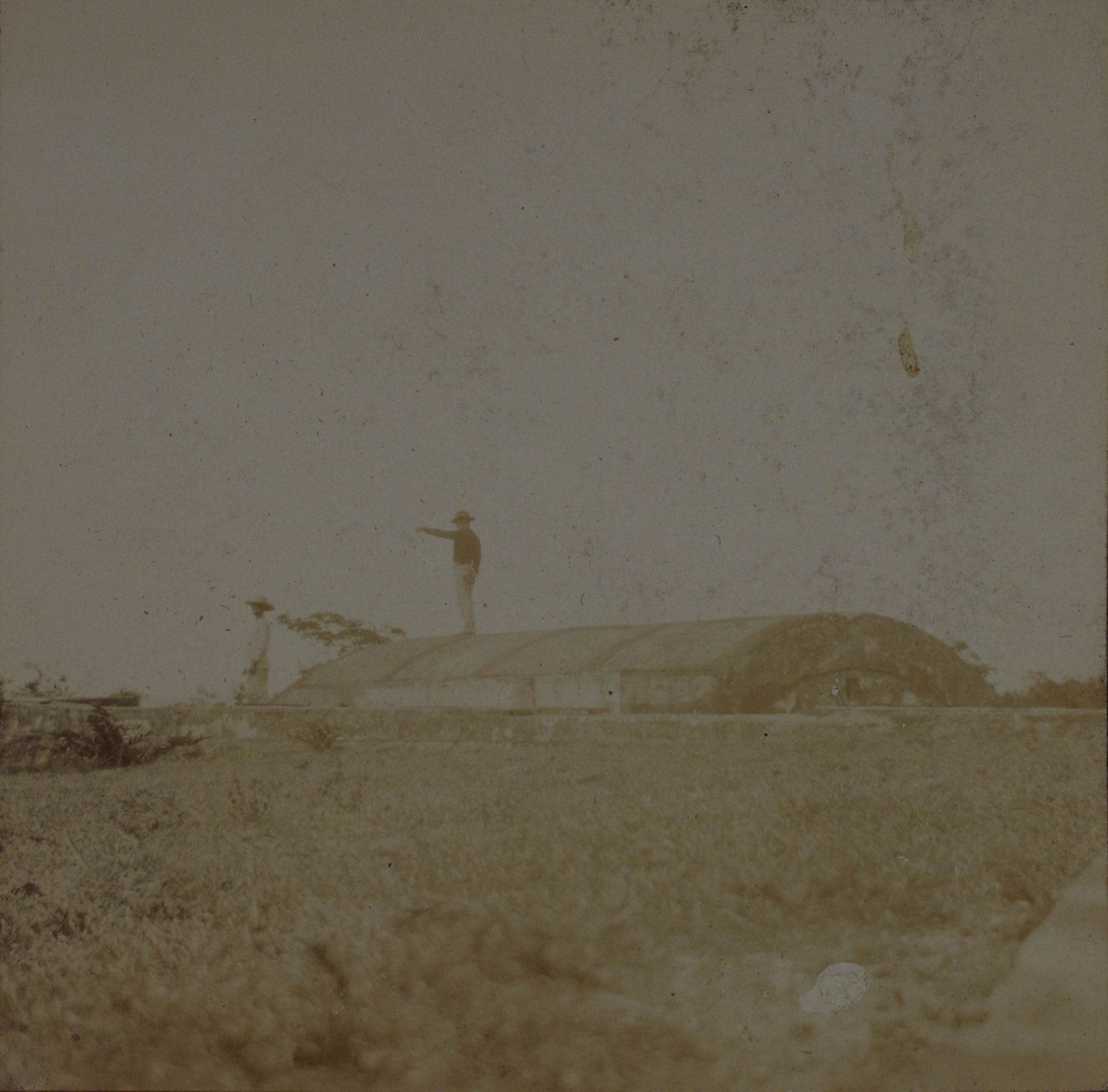 [Untitled – Soldier standing atop fortification].