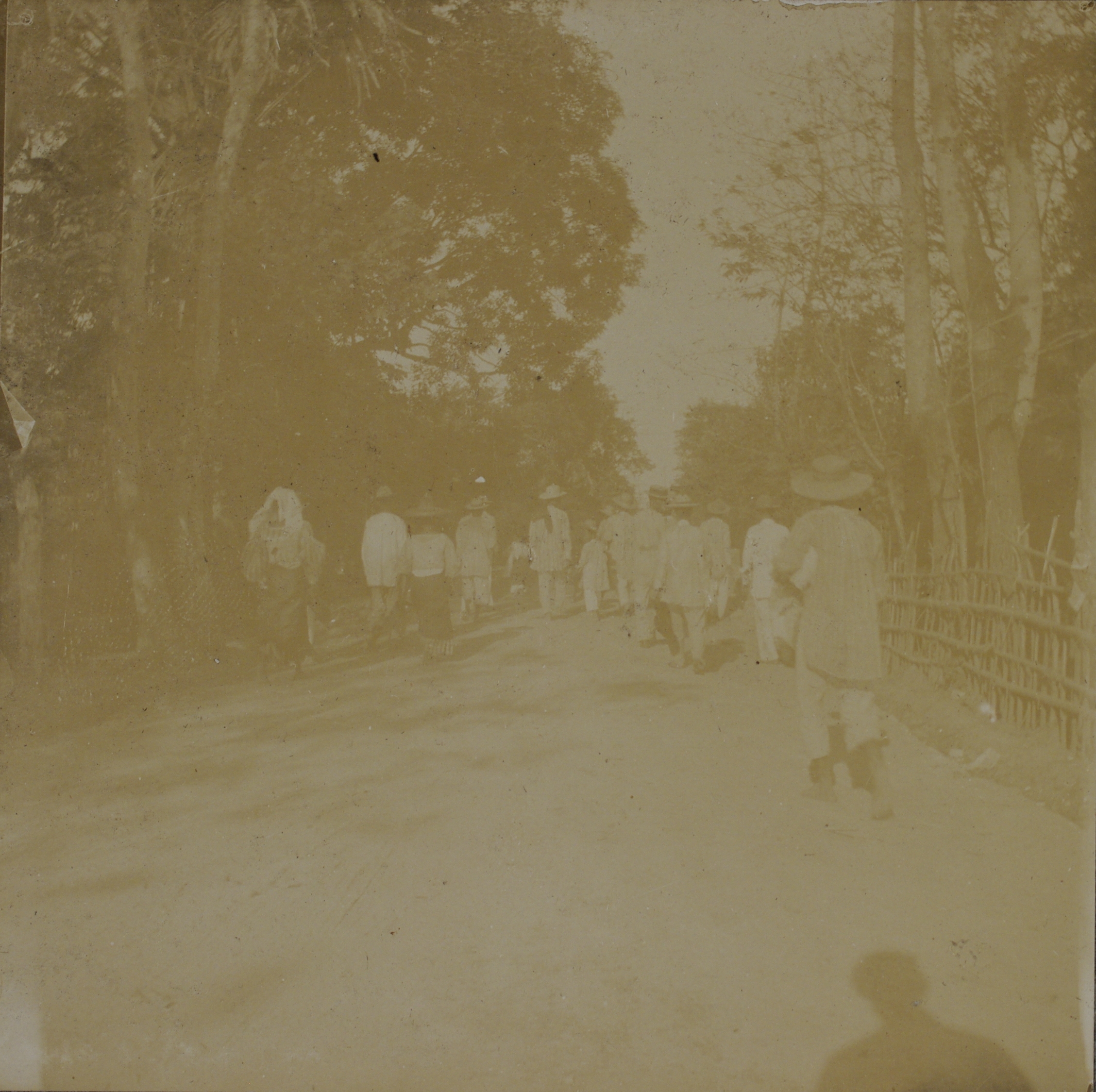 [Untitled – Filipinos walking down a road].
