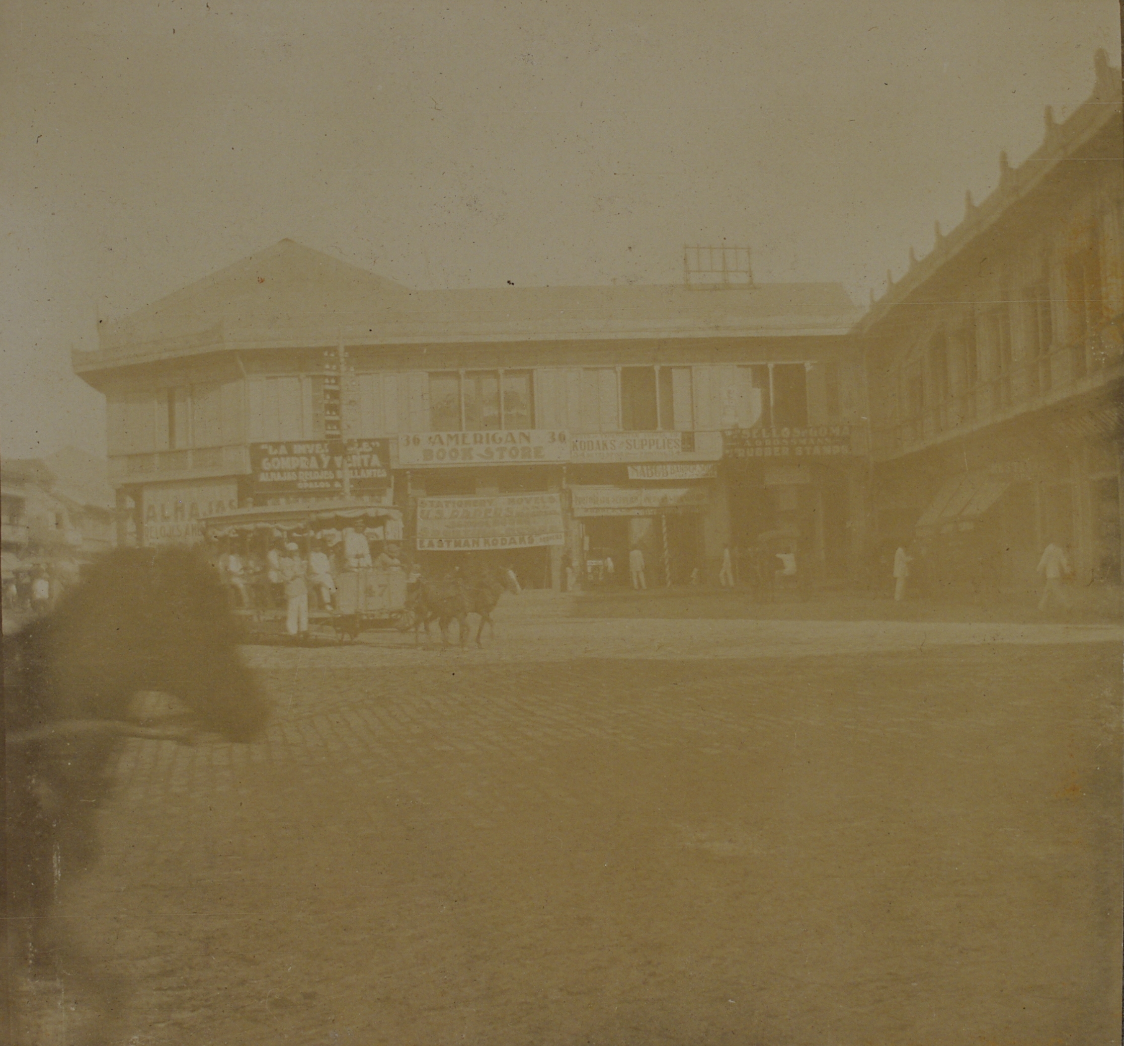 [Untitled – Plaza and shops, Manila?].