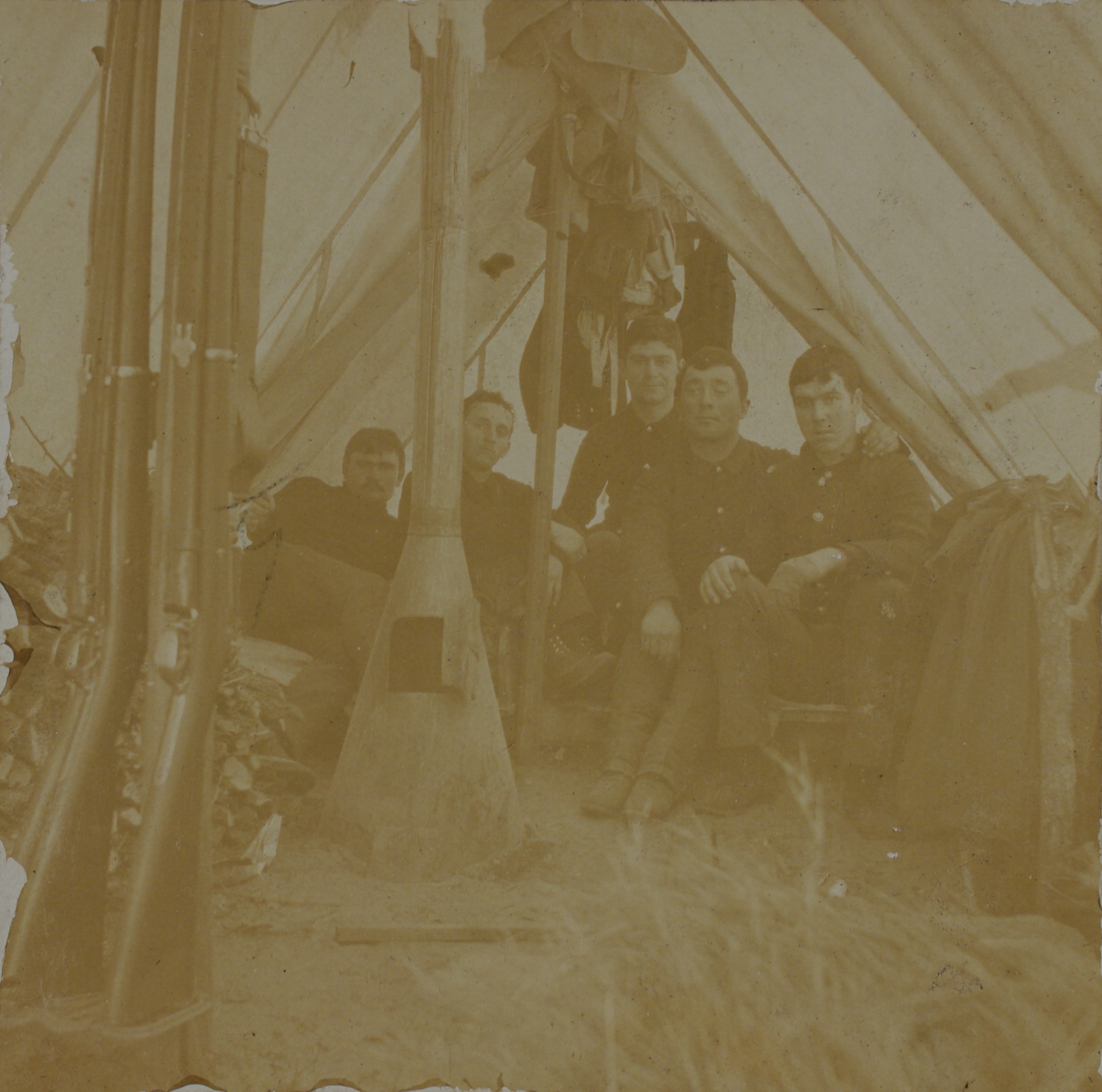 [Untitled – Group of soldiers in a tent with woodstove].