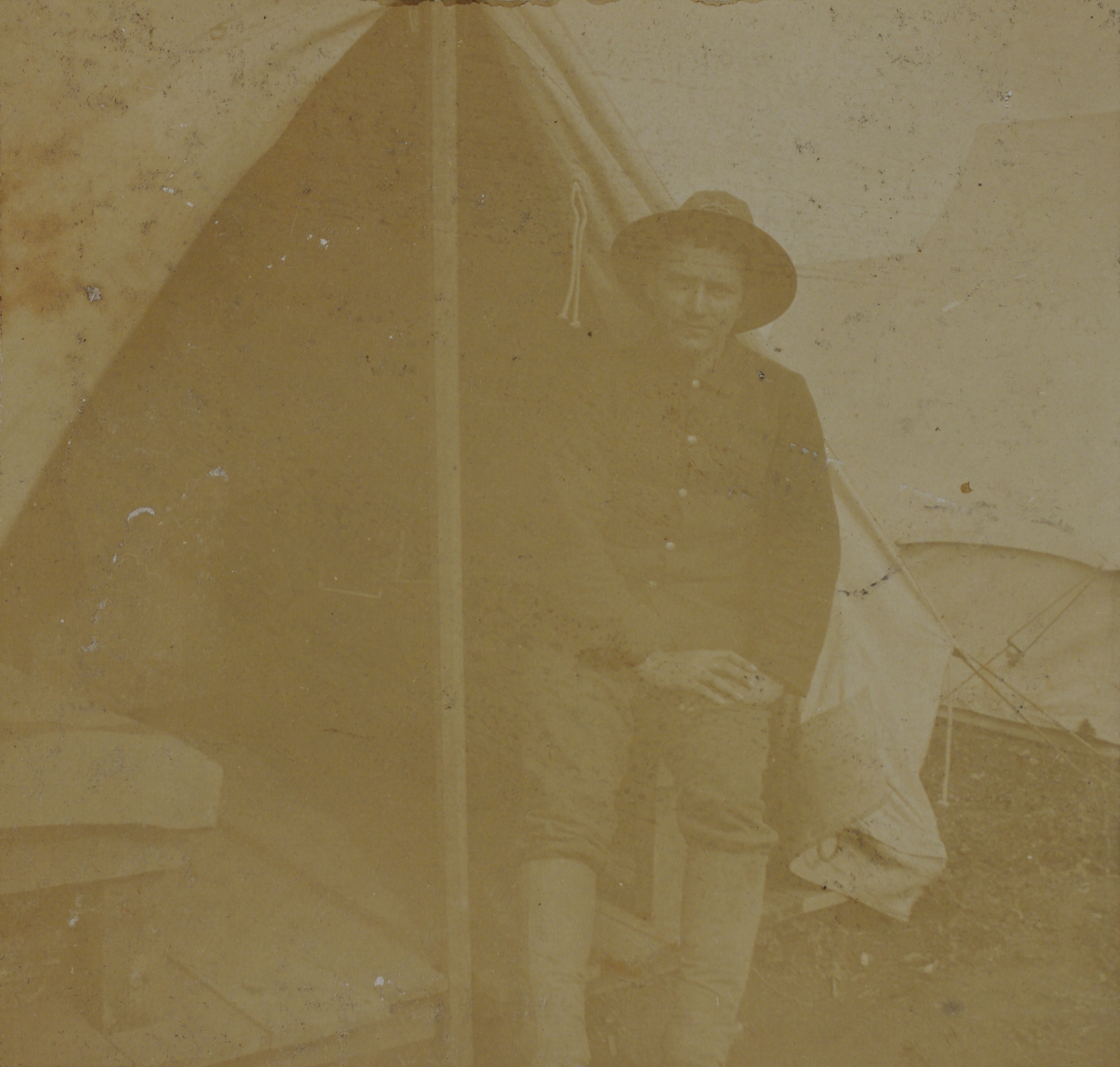 [Untitled – Soldier poses outside his tent].