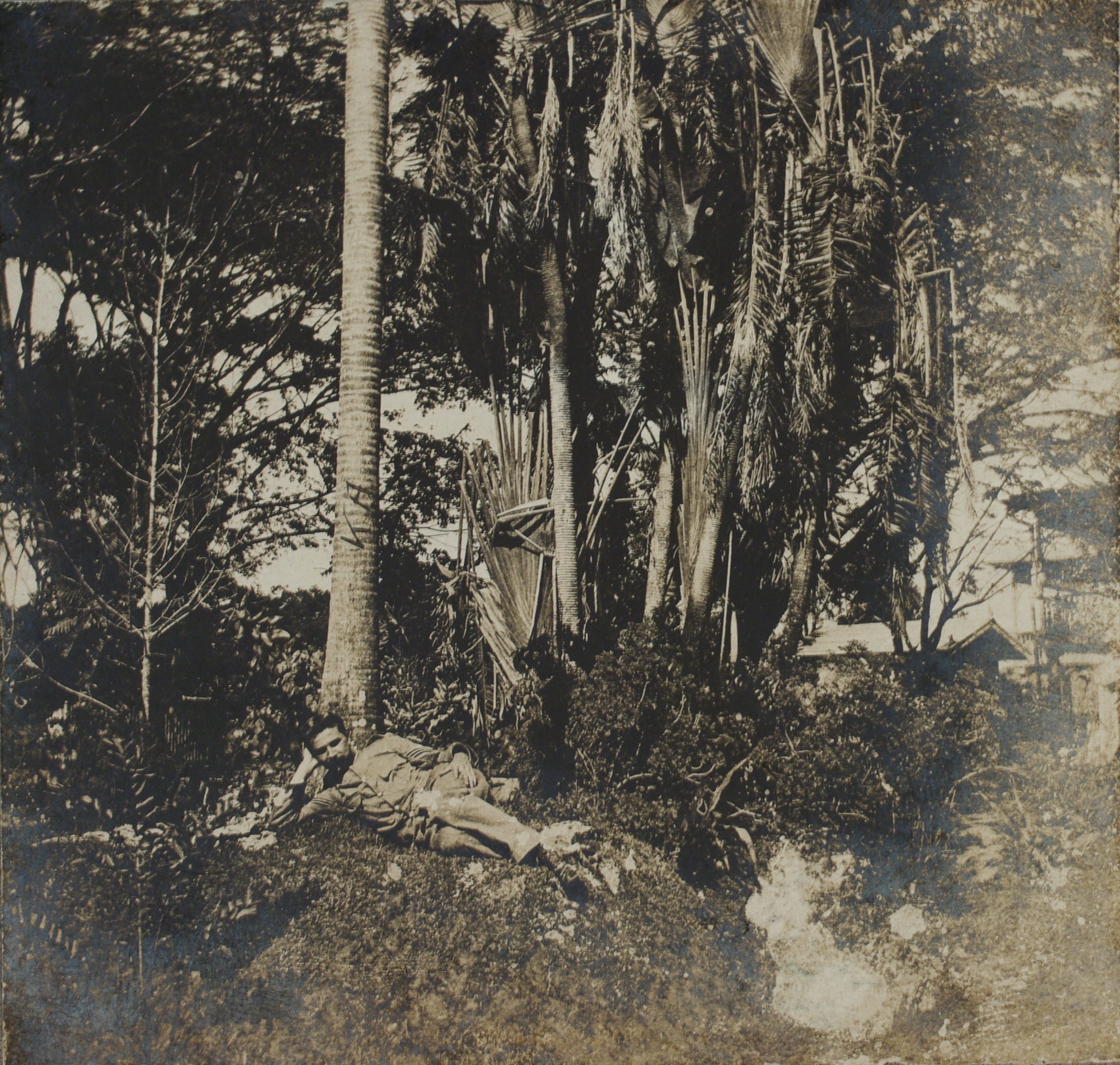 [Untitled – U.S. soldier relaxing on an earthen mound].