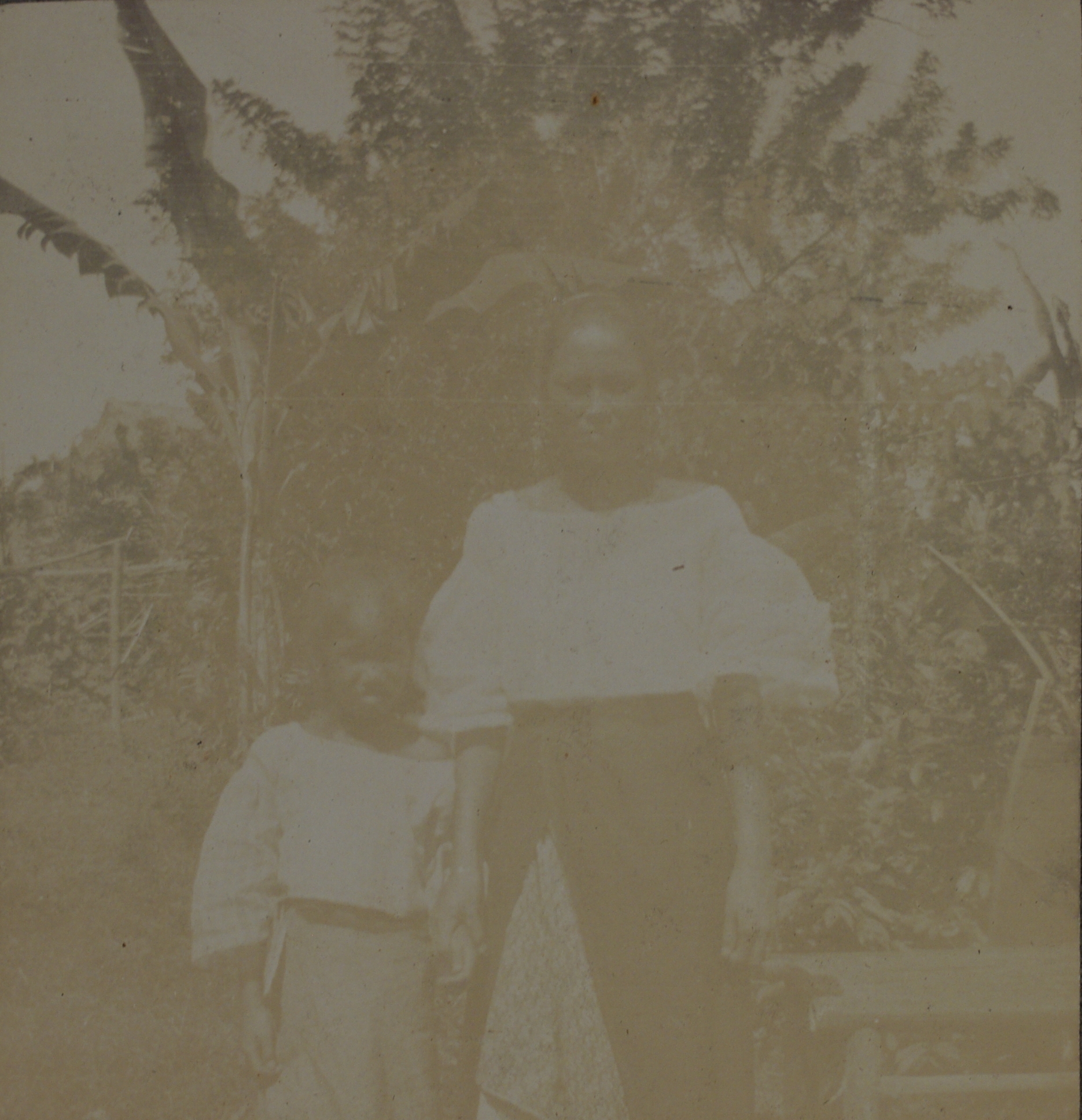 [Untitled – Filipina mother and child, neighbors?].