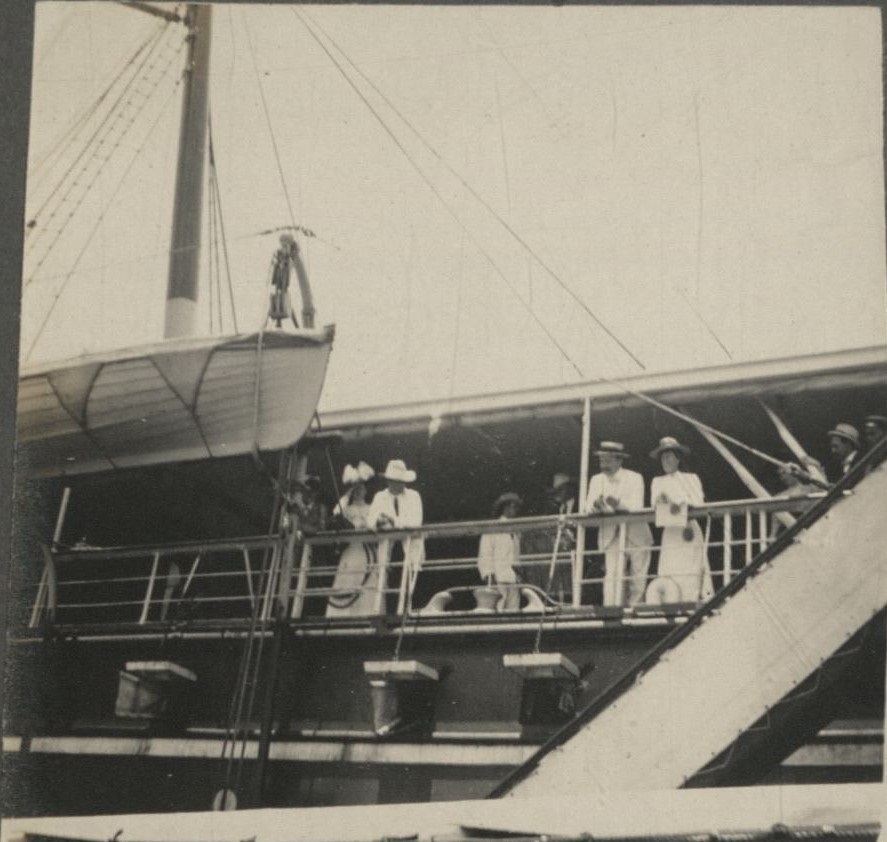 [Untitled – Expatriate couples on board an inter-island ship in port].
